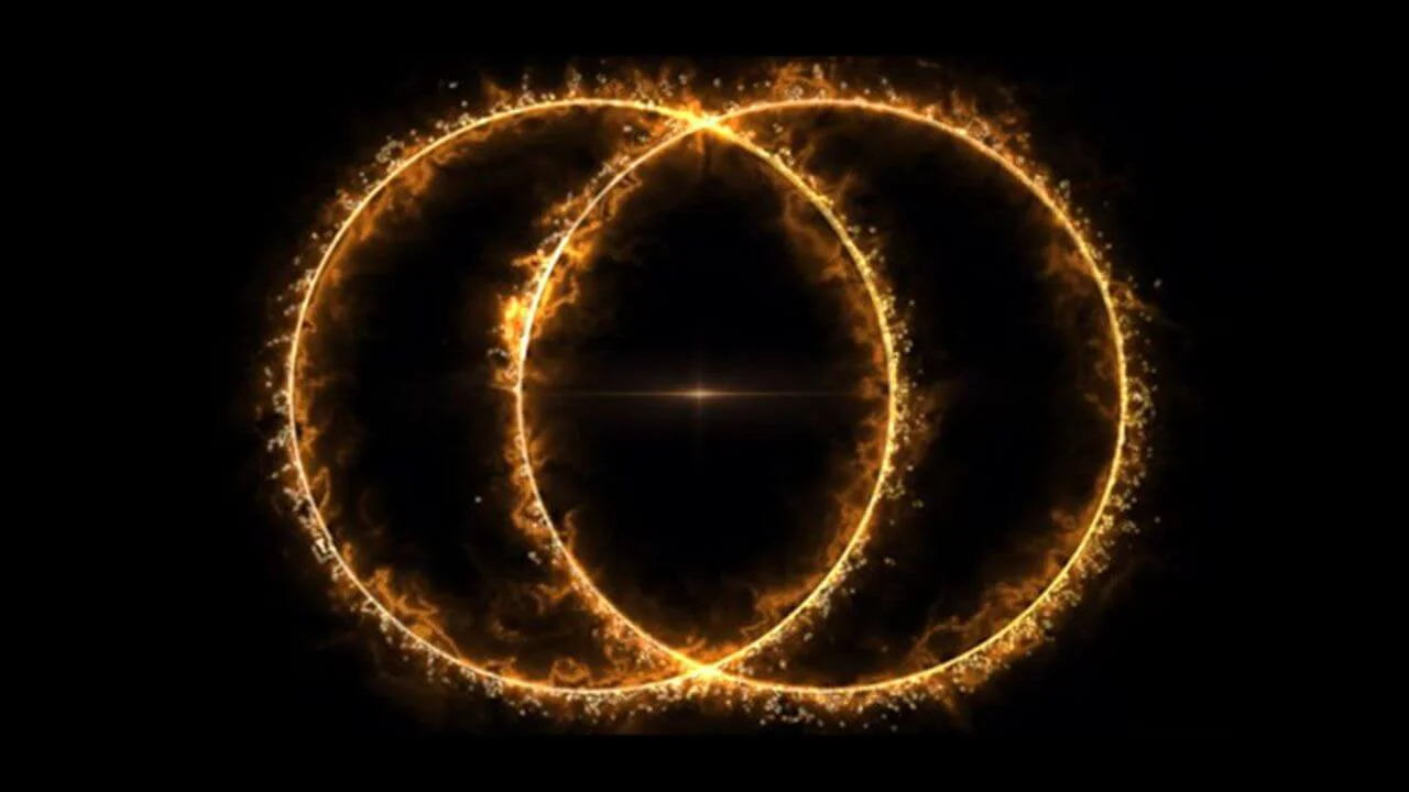 A digital rendering of two intersecting, glowing orange and yellow rings on a black background, resembling a Venn diagram or the ‘double-ring’ structure of a cosmic radio ring, with a bright star-like point at the center of the intersection.