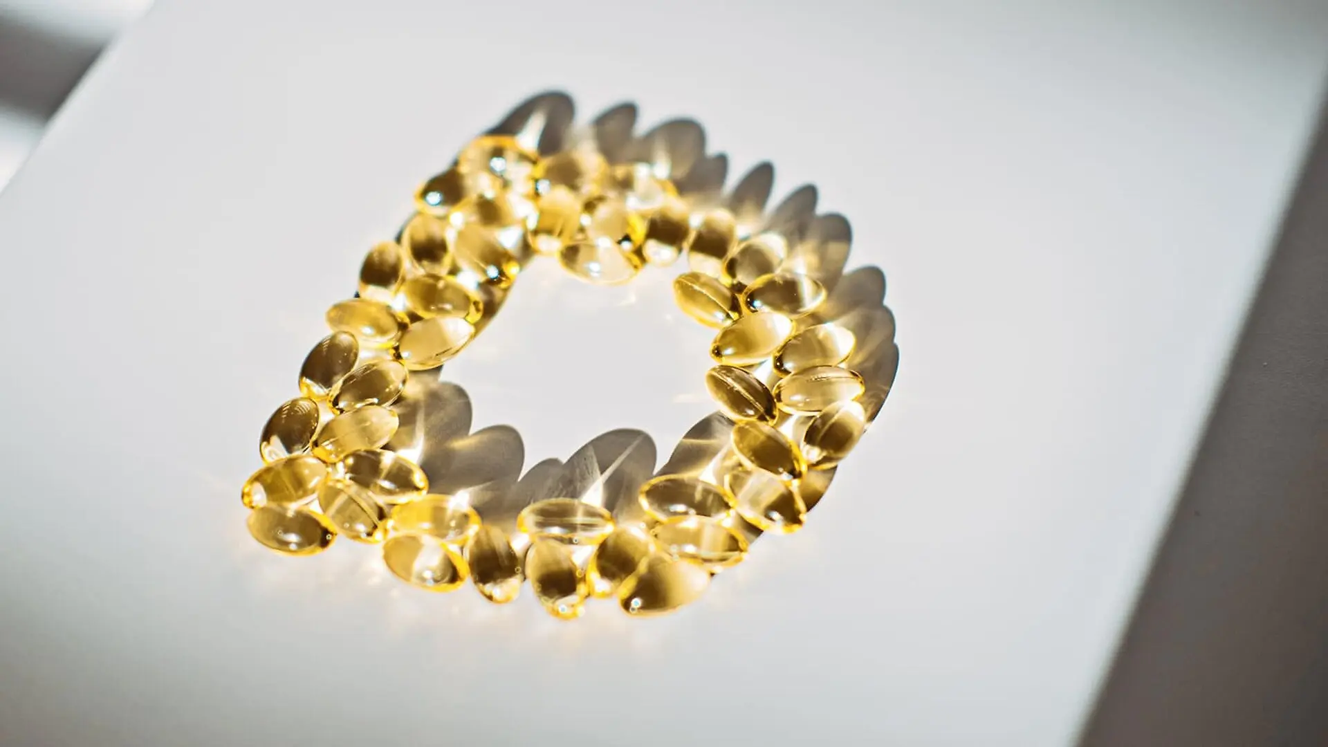Vitamin D pills arranged in the shape of the letter D.