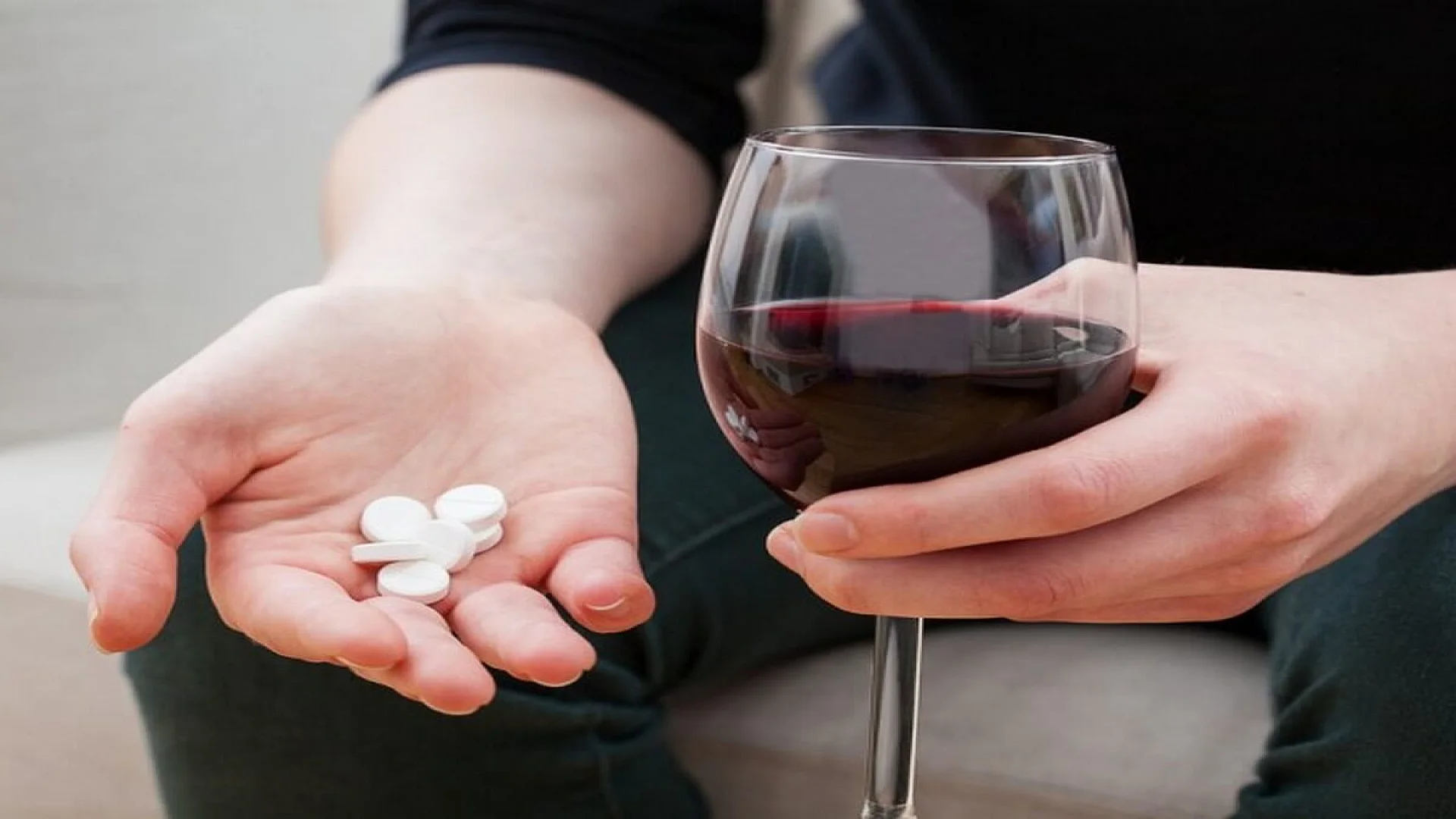 Woman trying to kill pain with pills and alcohol.
