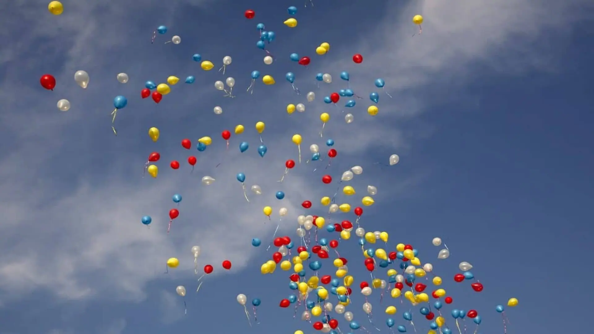 Balloons The Color Of Chickenpox Float In The Air Against The Sky Scaled