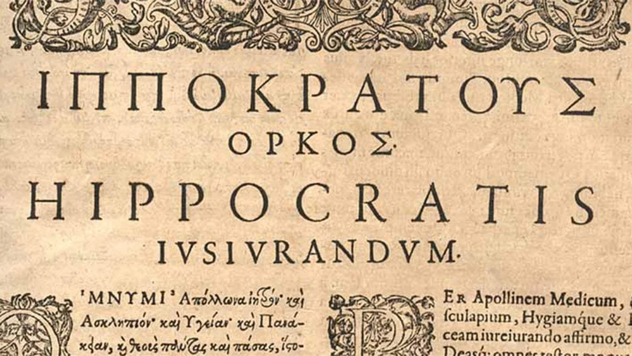 Close-up of a historical medical text showing the title Hippocratic Oath in Greek and Latin, with decorative early modern typography symbolizing the ancient and lasting legacy of medical ethics.
