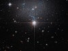 Hubble Reveals Hidden Dwarf Galaxy Illuminating Cosmic Flows