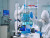 Scientist wearing coverall in equipped medical laboratory examining drug discovery with micropipette. biochemists analysing virus evolution using high tech researching vaccine against covid19