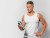 Front view of fit man with water bottle and copy space.