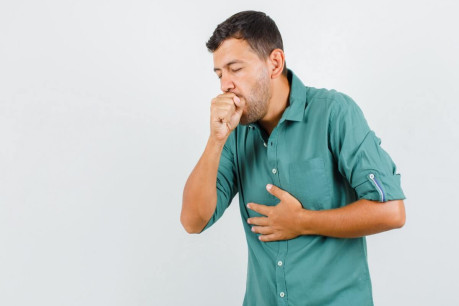 Free photo young man suffering from cough in shirt and looking ill.